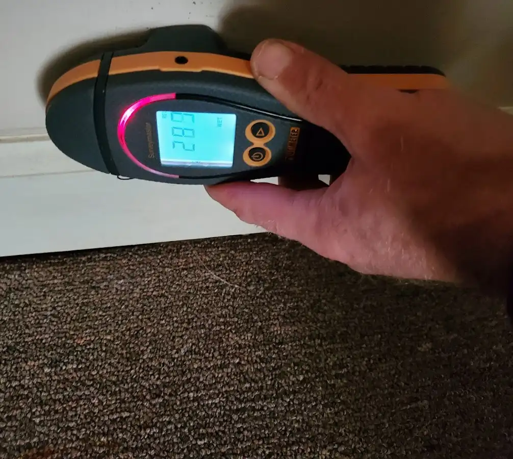 Moisture detection at baseboard during Storm Damage Restoration in Fanwood